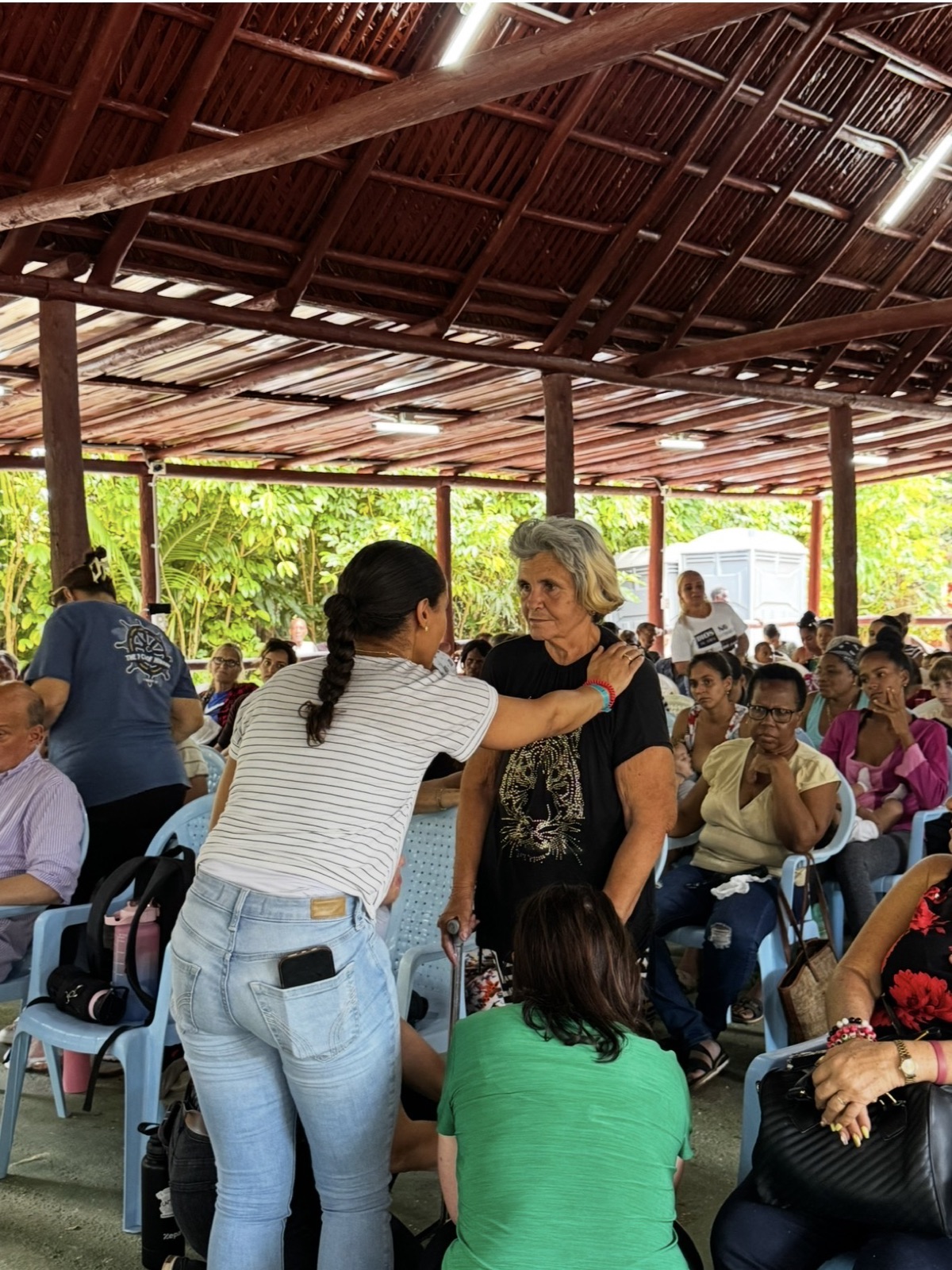 An outdoor pavilion gathering during a mission trip